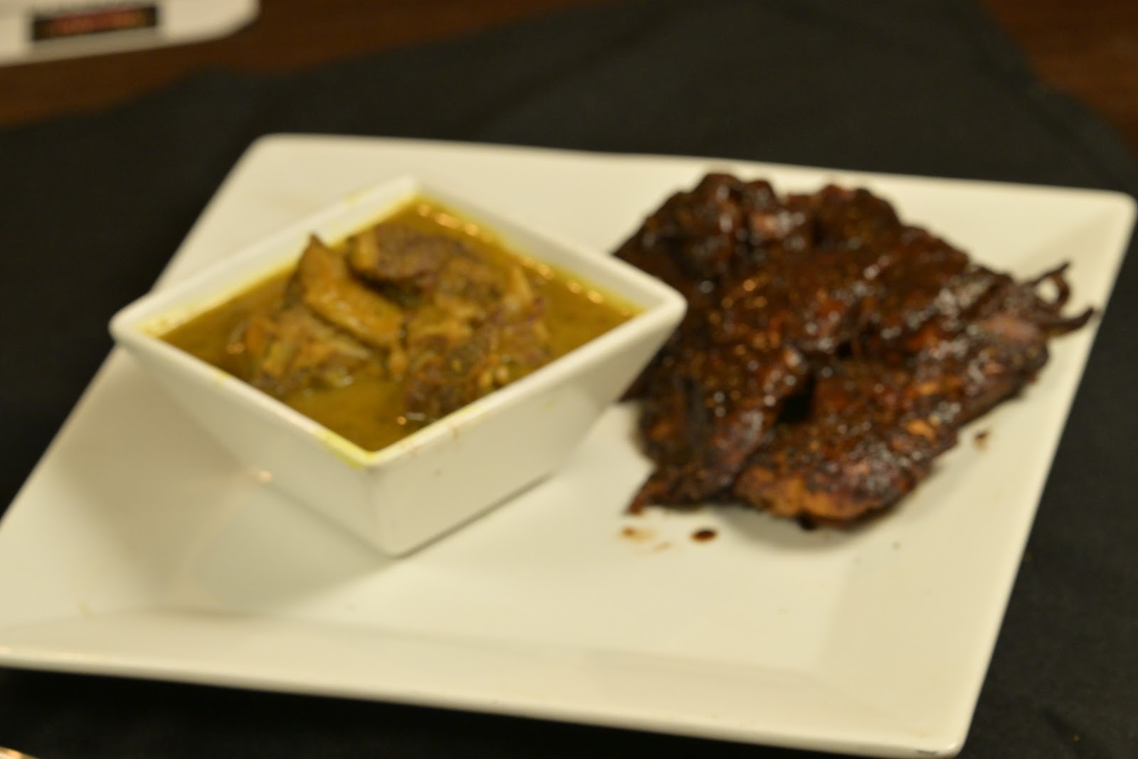 Jerk chicken plated with a golden curry