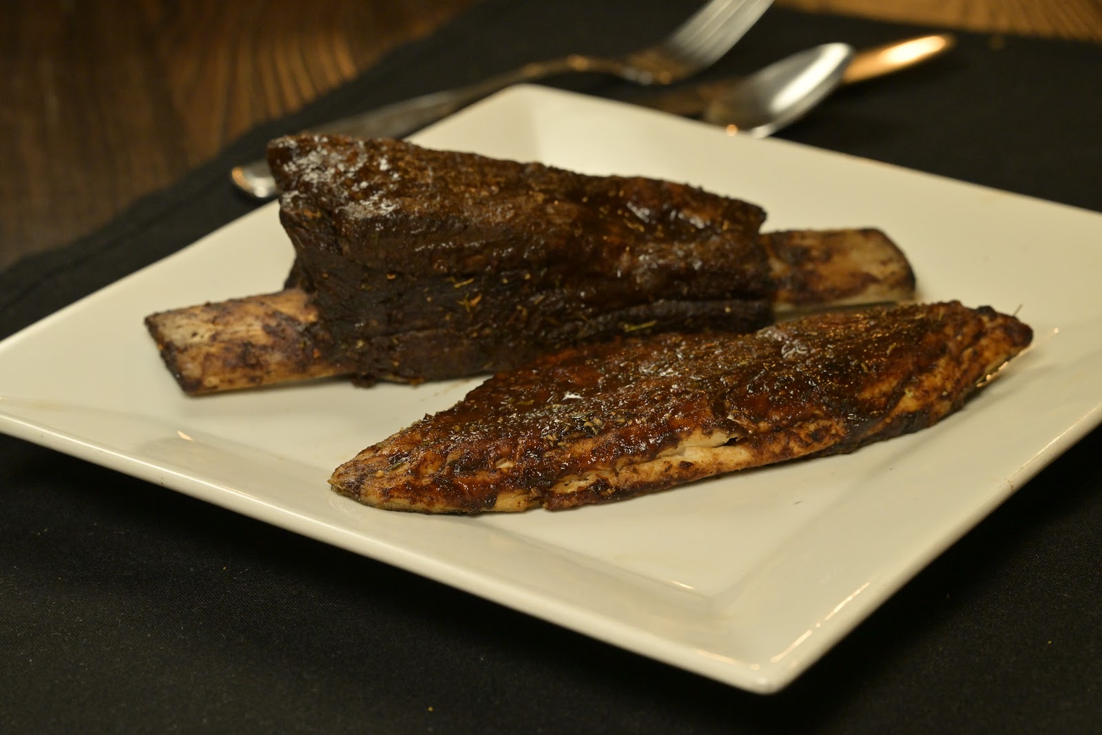 Glazed short ribs with a blackened snapper fillet