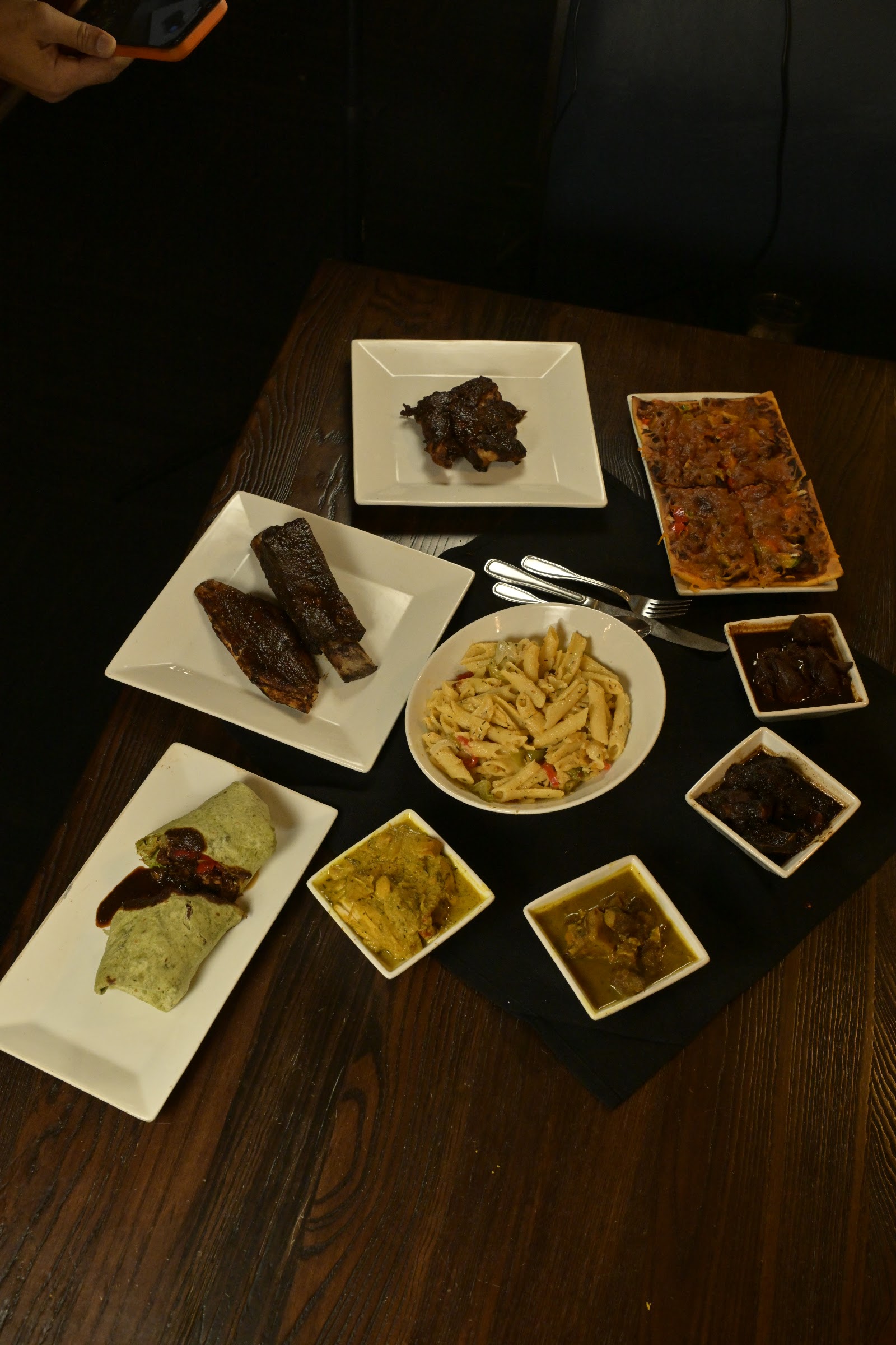 A full Shantoo spread of dishes on a wooden table